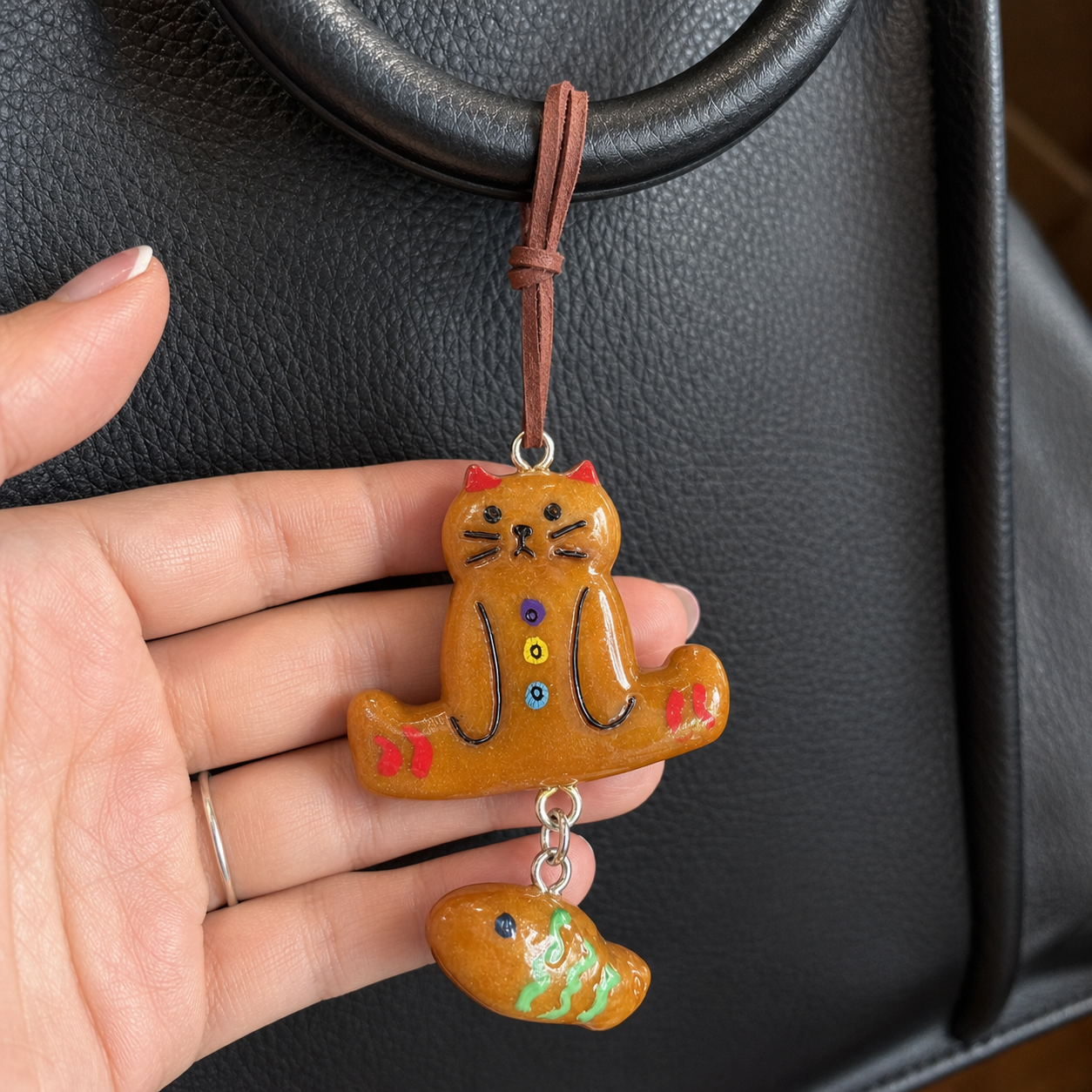 Close-up of Miso cat and little fish bag charm
