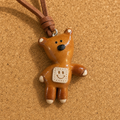 Macro view of handmade bear bread charm and textured smile patch