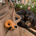 Sleepy Bagel Pup regular eyes real bread bag charm with a curled dachshund