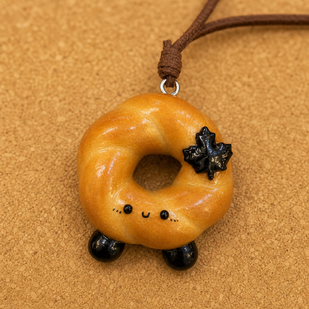 Macro detail of Doubie handmade bread art and brown leather cord